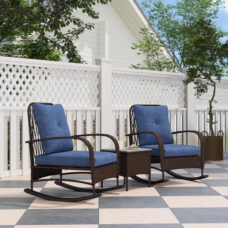 Brown PE rattan rocking chairs with blue cushions on an outdoor patio