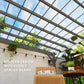 Gray wooden pergola roof close-up with evenly spaced beams and lattice slats
