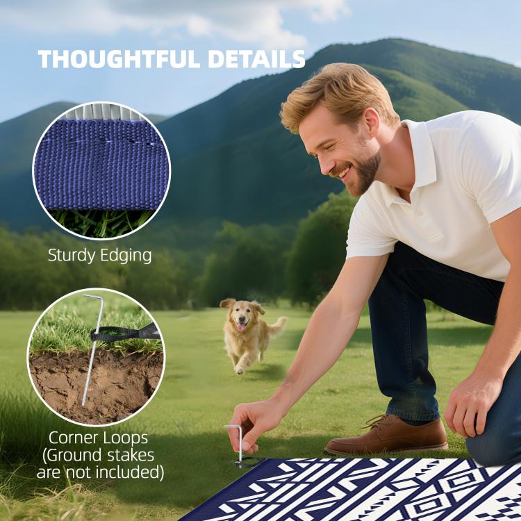 Reversible outdoor rug with blue-and-white geometric pattern, corner detail with loops