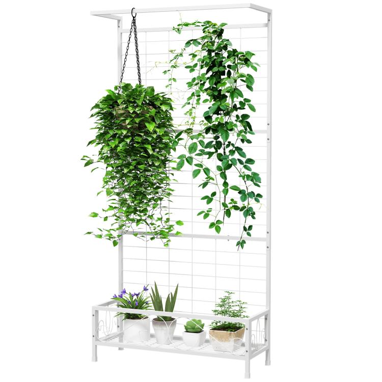 White metal plant stand with trellis backing and lower shelf for potted plants