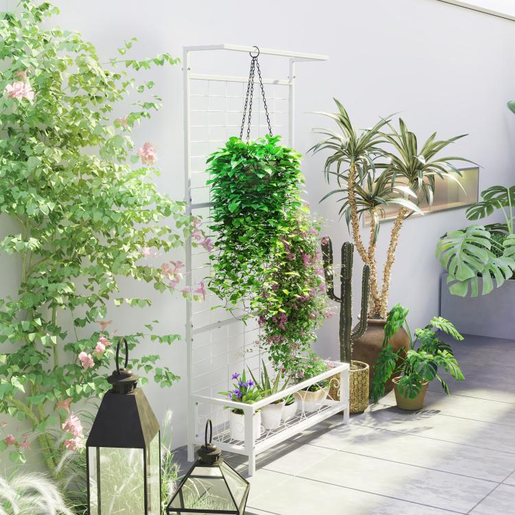White vertical plant stand with trellis grid, hanging chain, and bottom shelf for pots