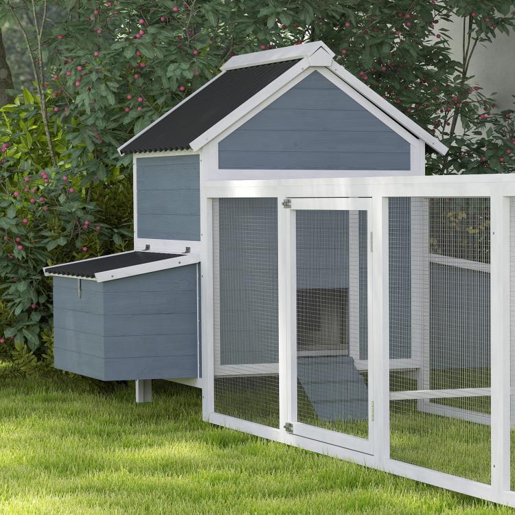 Light gray wooden chicken coop with enclosed run, side nesting box, and dark wave roof