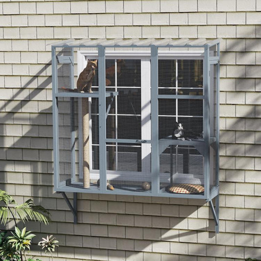 Gray window catio on house siding with cats inside, platforms, and scratching post