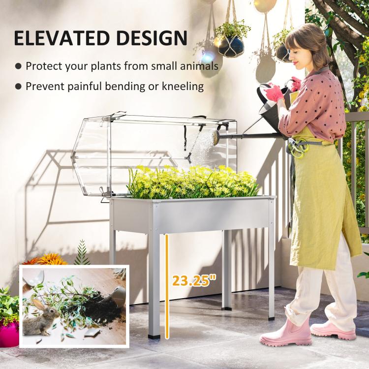 White elevated garden bed greenhouse with transparent cover and open front for access