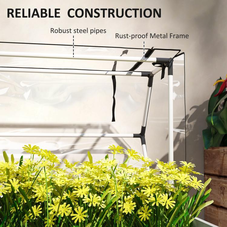 Clear greenhouse cover on white raised garden bed with sturdy metal frame pipes
