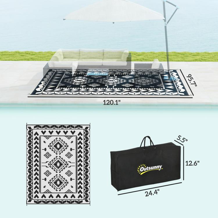 Outdoor rug detail with black-and-white geometric print and included carry bag