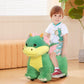 Green plush ride-on dinosaur toy with yellow belly, shown with a child