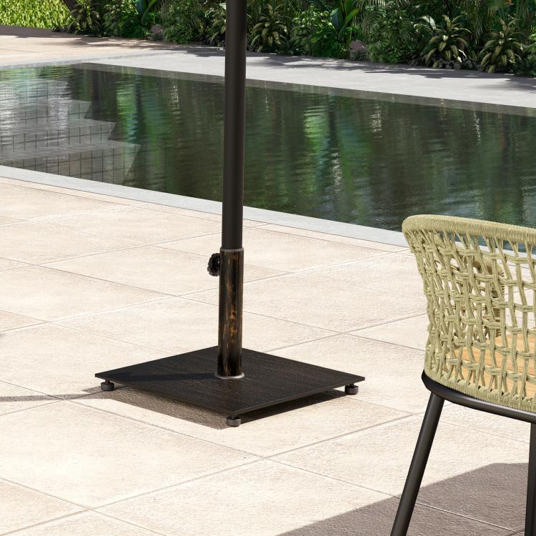 Square metal umbrella stand base on patio with pole support and side knob