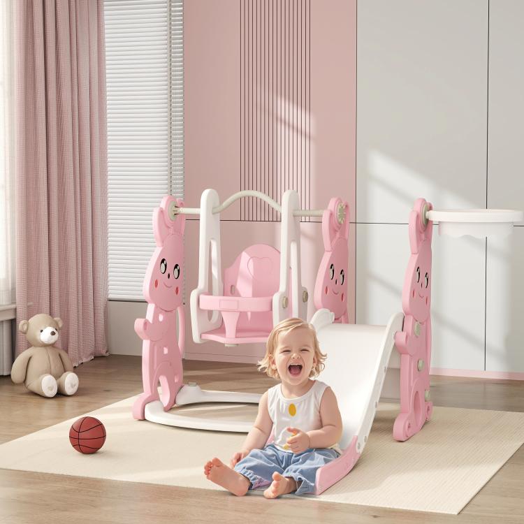 Pink indoor slide and swing set with rabbit figures, swing seat, and basketball