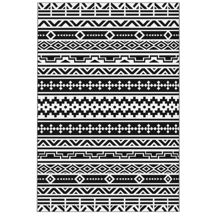 Black-and-white geometric outdoor rug design, close-up