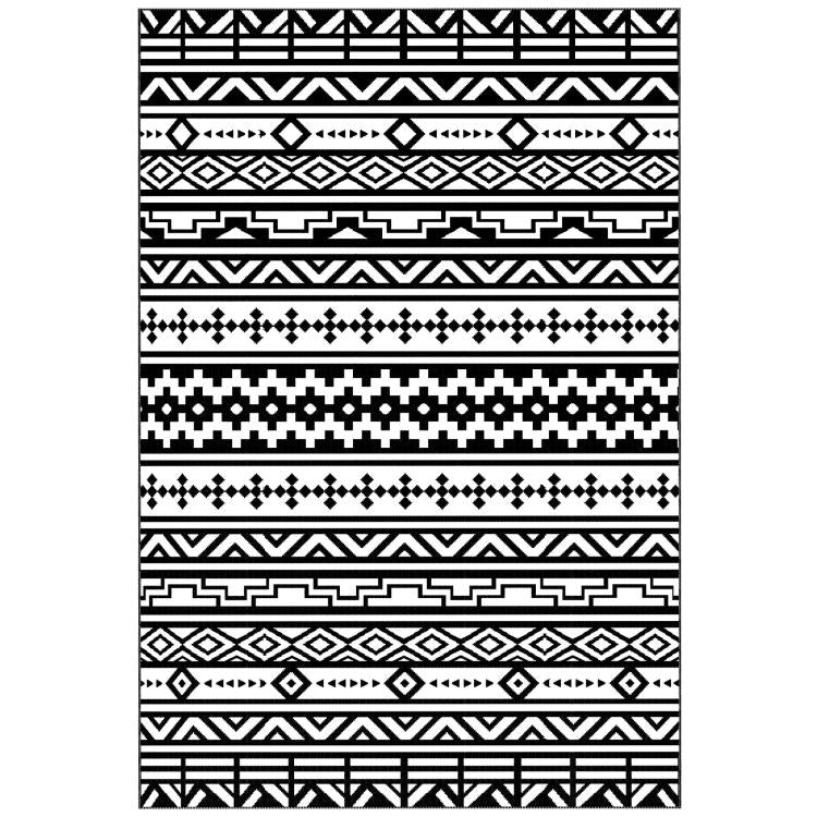 Close-up of black and white geometric rug pattern, reversible design