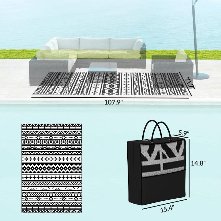 Black-and-white geometric outdoor rug with matching carry bag