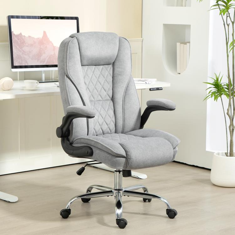 Gray executive desk chair with diamond quilt back, padded armrests, and chrome base