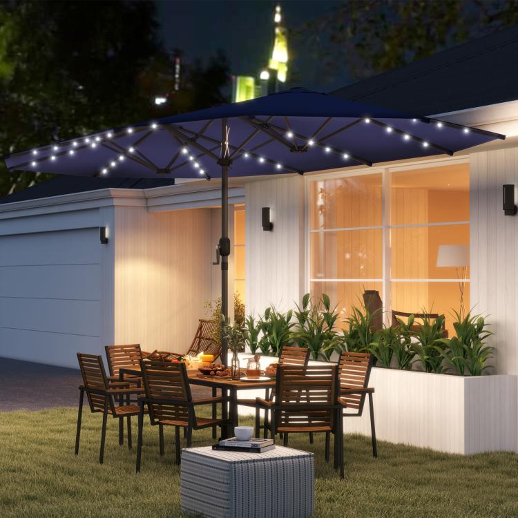 Navy patio umbrella with LED lights shading outdoor seating area