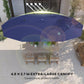 Navy patio umbrella canopy with LED light strings, overhead view
