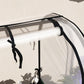 Covered raised garden bed frame with clear plastic cover and black metal bars