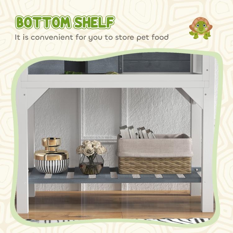 Gray wooden tortoise enclosure with clear front panels and bottom shelf for storage items