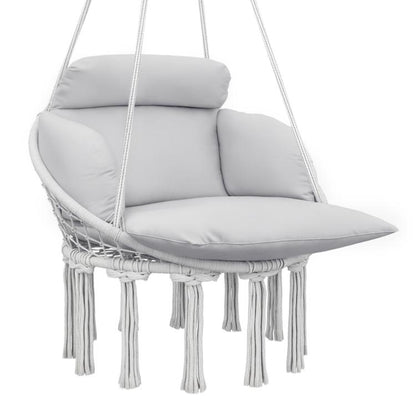 Gray macrame hanging hammock chair with large padded seat cushion and fringe tassels