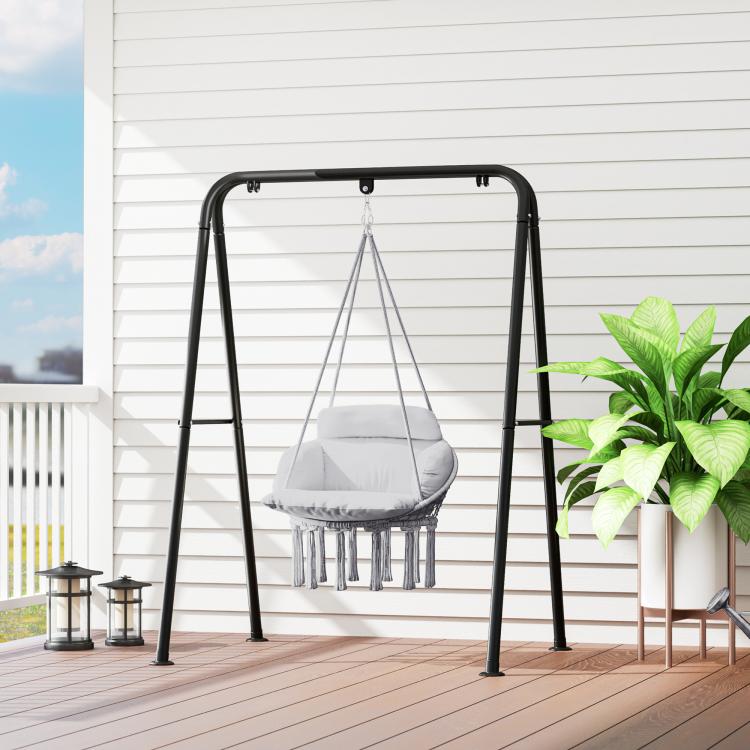 Gray hammock swing chair with macrame seat, padded cushion, and black steel frame