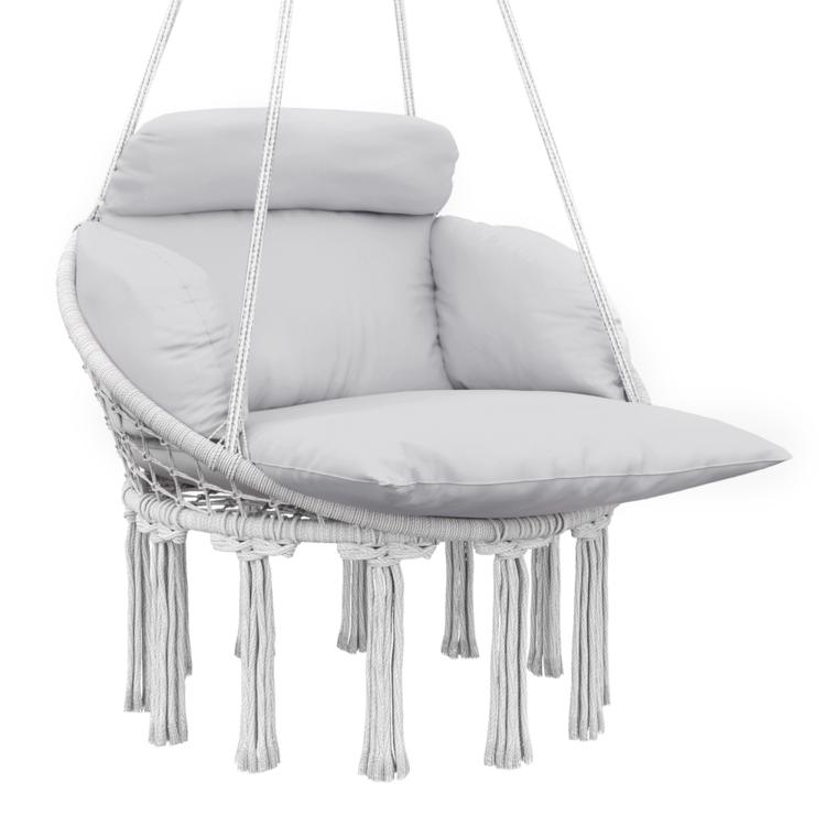 Macrame hanging swing chair with gray cushion and rope fringe seat, on hanging straps
