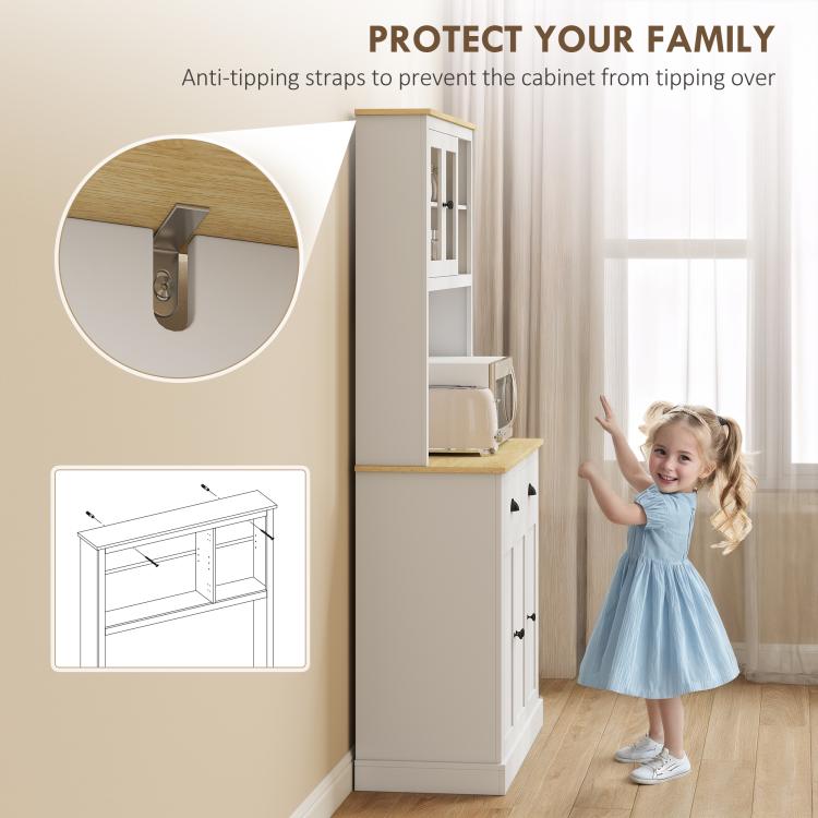 White kitchen cabinet with anti-tipping strap hardware at the top corner
