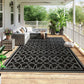 Outdoor reversible rug, black border with gray quatrefoil trellis pattern
