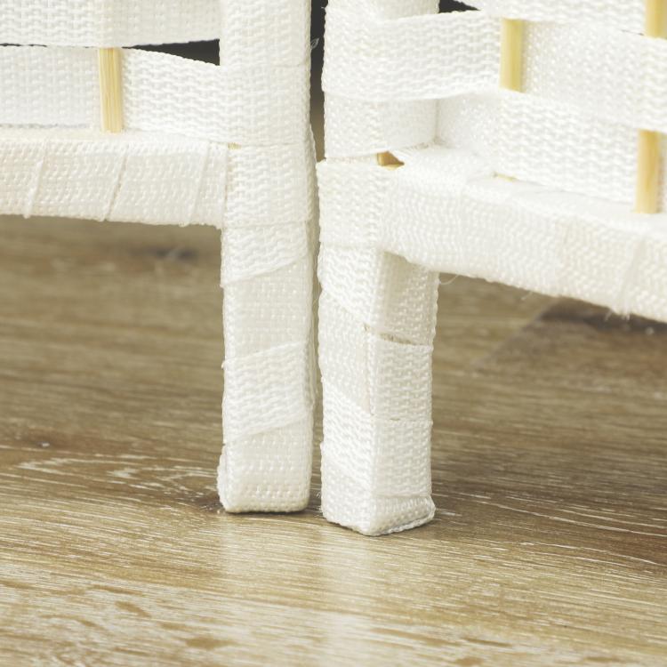 White folding room divider screen leg and woven fabric texture, close-up