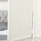 Close-up of white woven privacy screen panel with grid-like pattern and gold-tone trim