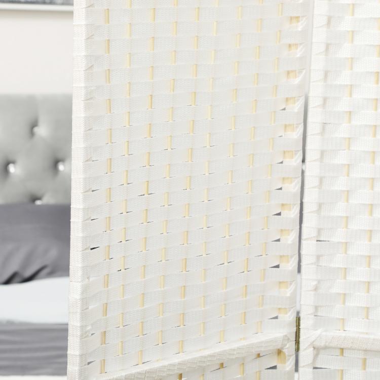 Close-up of white woven privacy screen panel with grid-like pattern and gold-tone trim