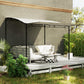 Outdoor gazebo with cream white canopy and black side panels for added coverage