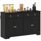 Black storage sideboard with four barn-style doors, two drawers, and brass ring knobs.