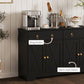 Black sideboard front detail with ring knobs and barn-style doors on cabinet storage.