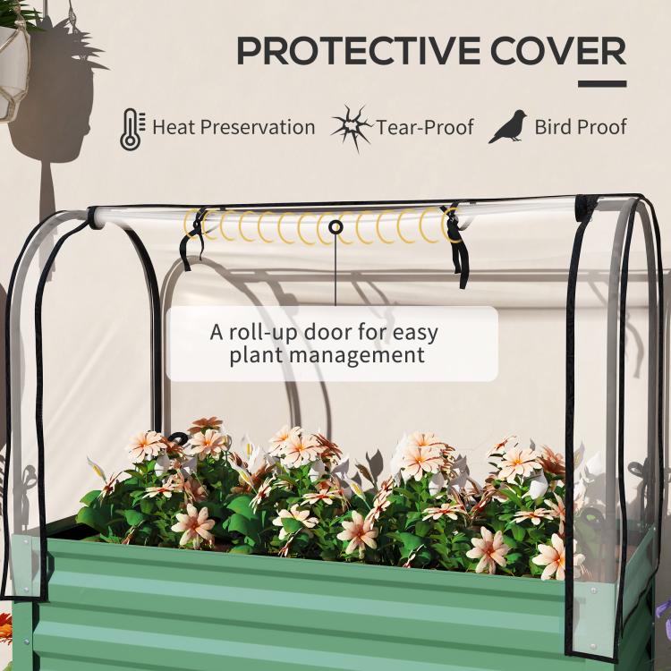 Green raised planter with clear roll-up door cover and arched protective frame