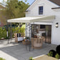 Outdoor pergola canopy with cream roof and black metal frame posts