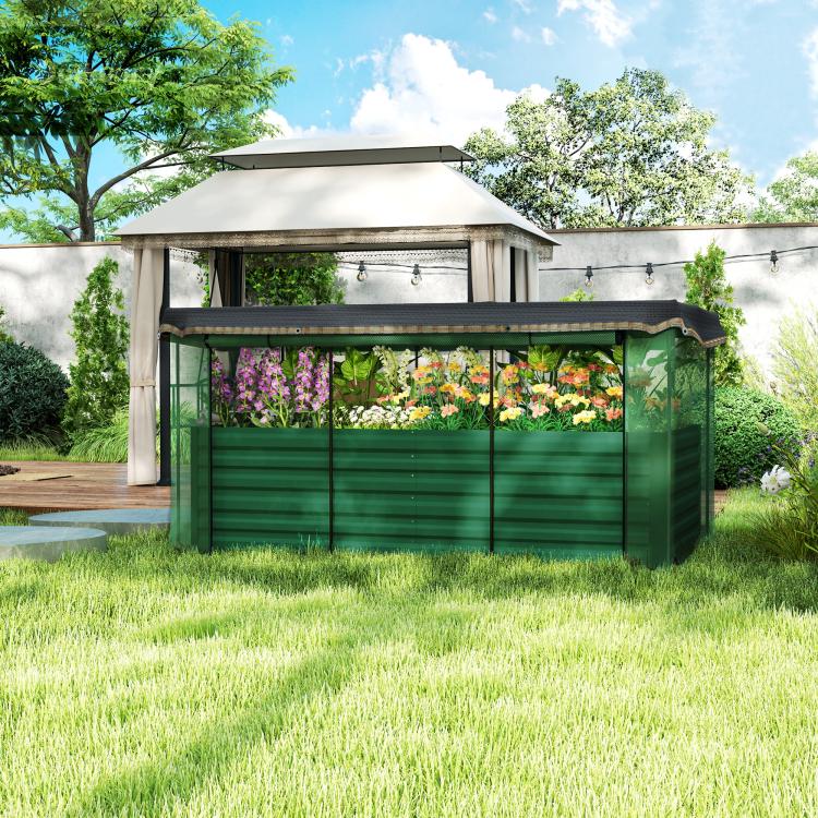 Outdoor green galvanized steel planter box with flower-filled raised bed under shade cloth