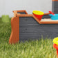 Kids wooden pirate ship sandbox, gray boards with orange trim and corner detail