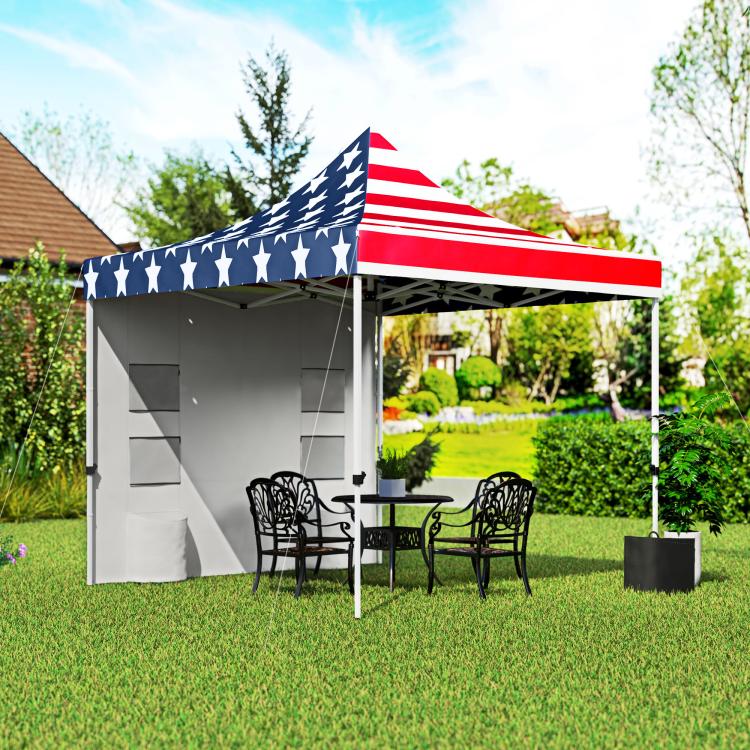 American flag pop-up canopy tent with gray sidewalls and outdoor table chairs