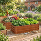 Brown wooden raised garden bed with slatted sides, filled with flowers, herbs, and greenery