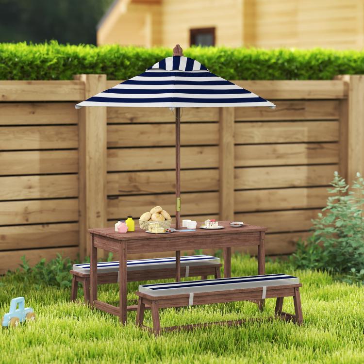 Kids wooden picnic table with navy striped umbrella over bench seating