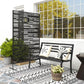 Black metal privacy screen with layered horizontal stripe design, freestanding