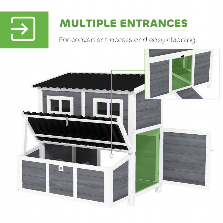 Wooden chicken coop showing multiple entry doors and nesting box access