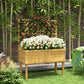 Elevated wood planter with trellis, filled with red and white flowers