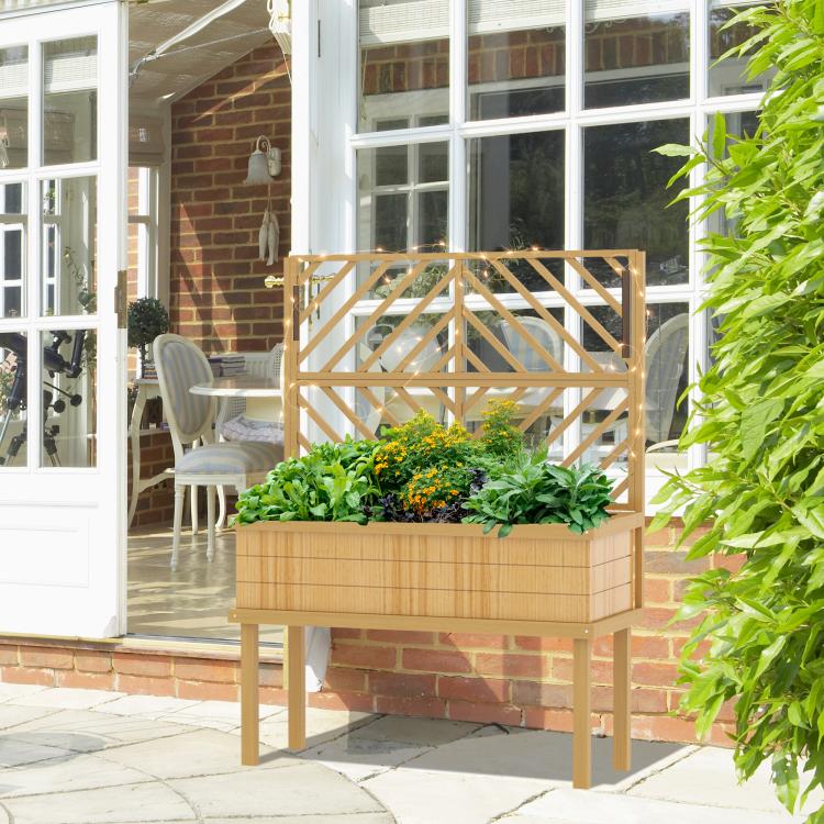 Wood raised planter with trellis on four legs, filled with green plants