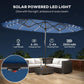 Blue patio parasol with solar-powered LED light string and center pole