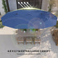 Blue parasol canopy with LED lights, top-down view over outdoor patio