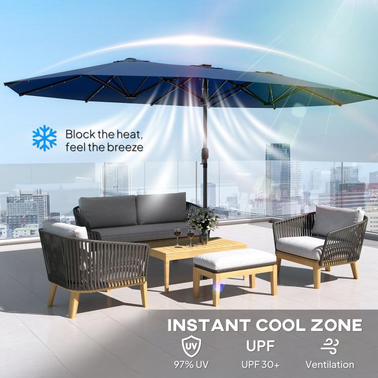 Blue double canopy patio parasol with LED lights above outdoor seating