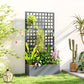 Gray raised garden bed planter with tall trellis panel and lush plants