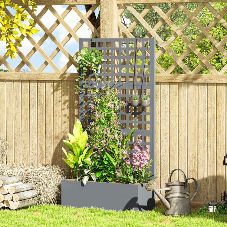 Gray raised planter with tall trellis grid, leafy vines, and purple blooms