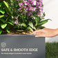 Gray planter box with smooth edge, purple orchid-like flowers, and green leaves