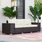 3-seat outdoor wicker sofa with armrests and storage, cream cushions on dark frame